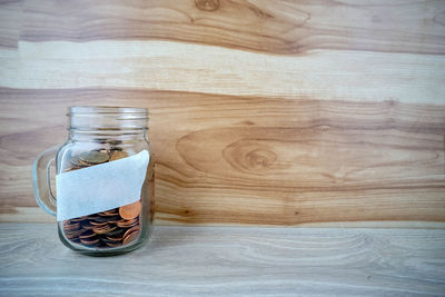 Close-up of glass jar on table