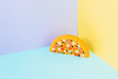 High angle view of pumpkin on table against blue background