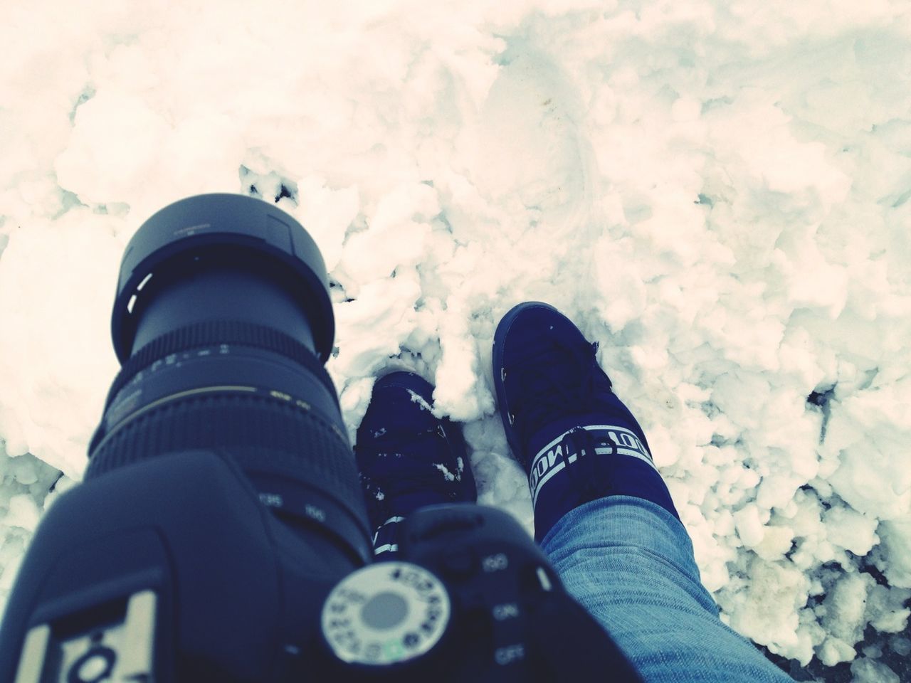 personal perspective, winter, cold temperature, low section, shoe, high angle view, snow, weather, person, season, outdoors, unrecognizable person, day, lifestyles, frozen, cloud - sky, water