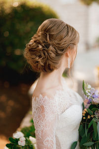 Close-up of bride looking away while standing outdoors