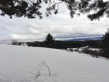 Scenic view of landscape against sky during winter