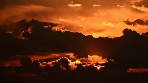 Low angle view of cloudy sky at sunset