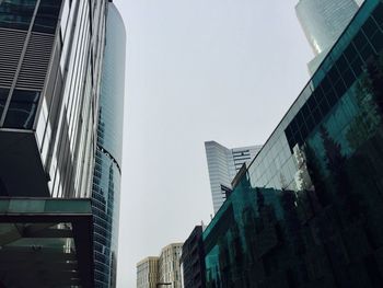 Low angle view of skyscrapers against clear sky