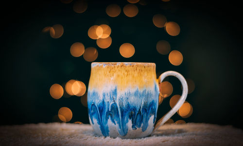 Close-up of coffee cup on table