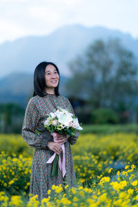 Woman standing on field