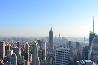 Skyscrapers in city against clear sky