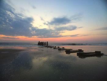 Scenic view of sea against dramatic sky