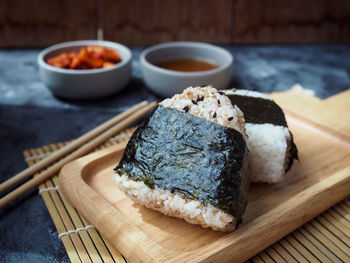 Close-up of japanese rice ball on cutting board