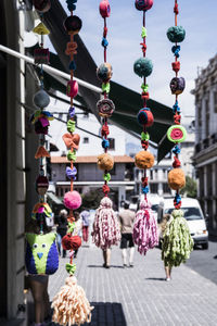 Close-up of decorations hanging in row for sale