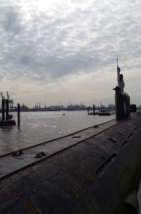 Scenic view of sea by buildings against sky