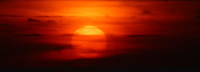 Scenic view of dramatic sky during sunset