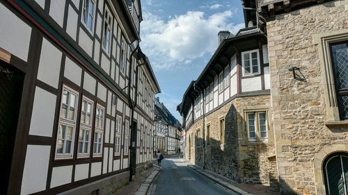 Street amidst buildings against sky