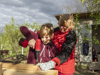 Children playing with plants