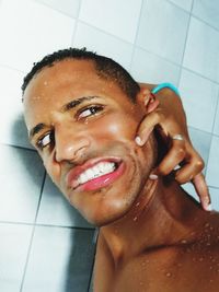 Portrait of young man in bathroom