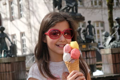 Portrait of woman holding ice cream