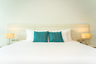 Deck chairs on bed against wall at home