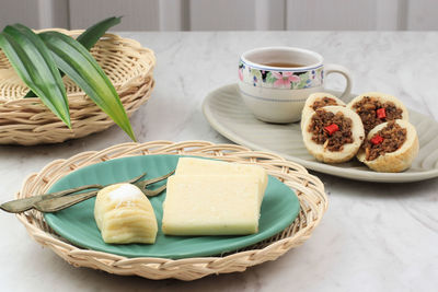 Getuk bandung and talam oncom, popular snack jajanan pasar in west java, served with tea