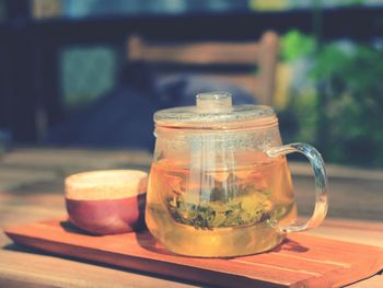 Close-up of tea in jar on cutting board