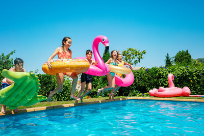 Group of people at swimming pool