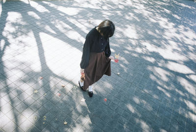 Rear view of man walking on street