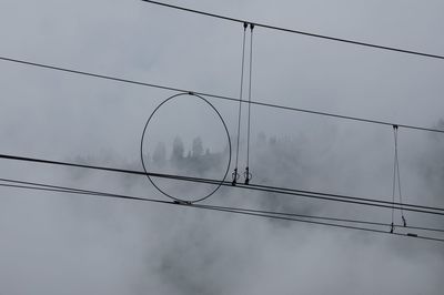 Electric cables during foggy weather