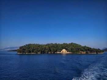 Scenic view of sea against clear blue sky