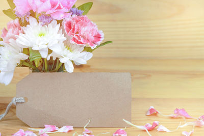 Close-up of pink flowers on table