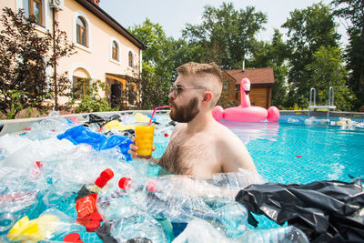 Shirtless man in swimming pool