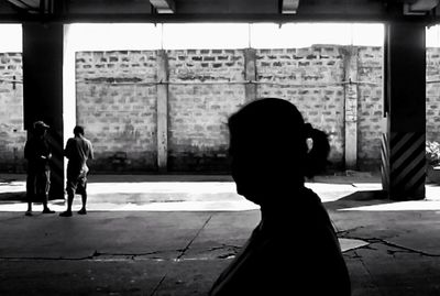 Silhouette of woman standing in park