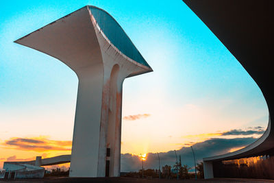 Low angle view of silhouette building against sky during sunset