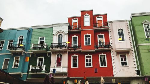 Low angle view of red building against sky