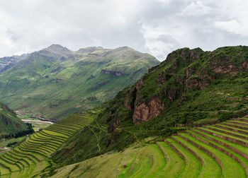 Scenic view of mountains against cloudy sky