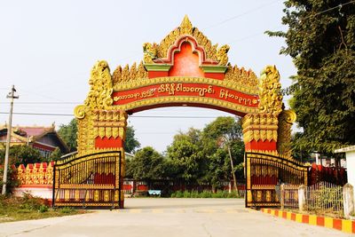 Entrance of temple against clear sky in city