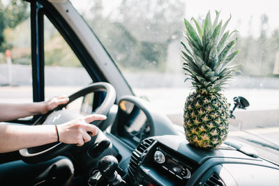 Cropped image of woman driving car