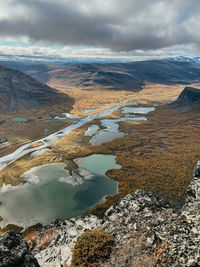 Aerial view of snowcapped mountains against sky