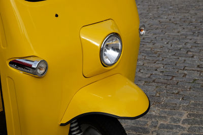 Close-up of yellow car