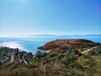 Scenic view of sea against clear blue sky