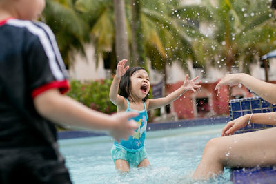 Girl playing in swimming pool