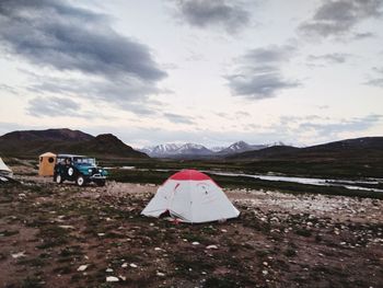 Tent on field against sky