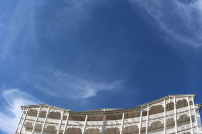 Low angle view of ferris wheel against sky