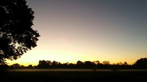 Scenic view of landscape at sunset