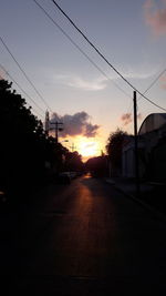 Road in city at sunset