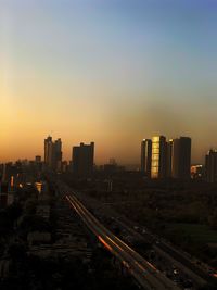 High angle view of buildings against sky during sunset