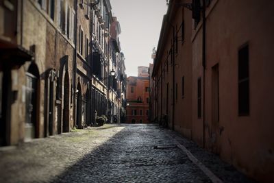 Narrow alley amidst buildings in city