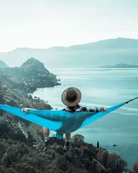 Man sitting on hammock