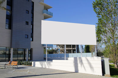Modern building against clear blue sky on sunny day