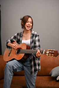 Young man playing guitar