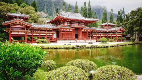 Scenic view of lake by byodo-in temple