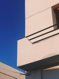 Low angle view of building against blue sky