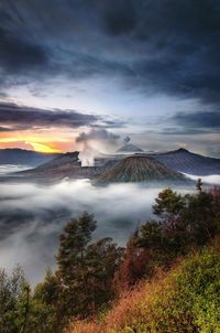 View of volcanic landscape against cloudy sky